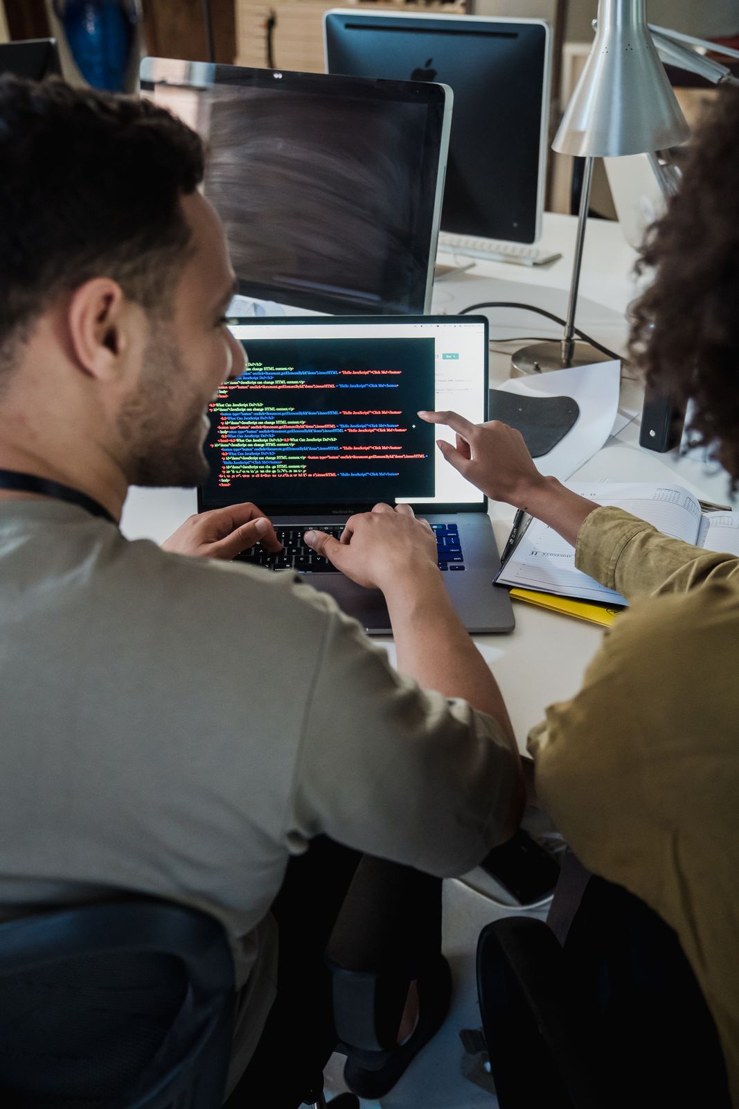 Developers reviewing code together